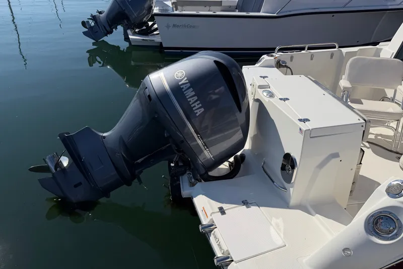 Slide: The Image of 2017 Cutwater C-242 Coupe with Yamaha outboard motor, docked on calm water. - 5