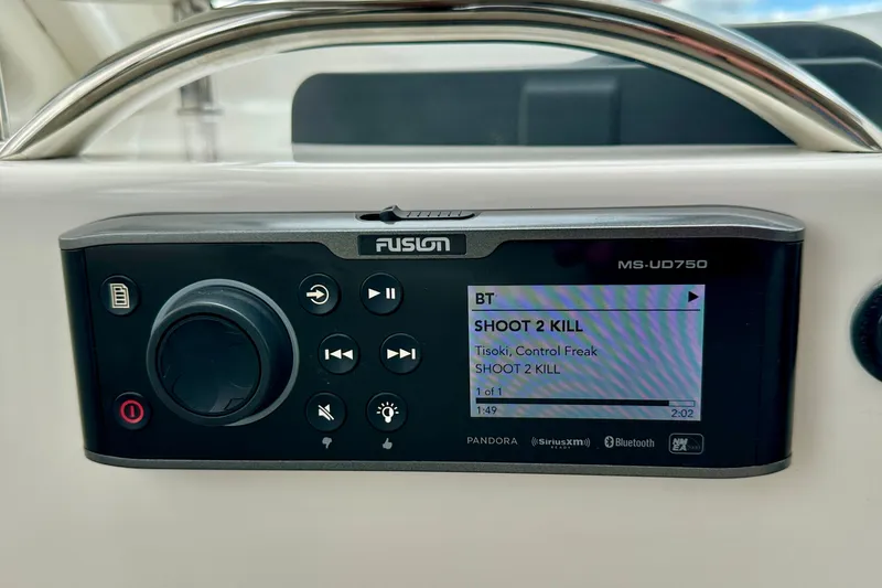Slide: The Image of Fusion MS-UD750 stereo system on 2017 Cutwater C-242 Coupe displaying "Shoot 2 Kill" track. - 19