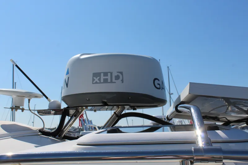 Slide: The Image of Radar equipment on 2017 Cutwater C-242 Coupe boat under clear blue sky. - 25