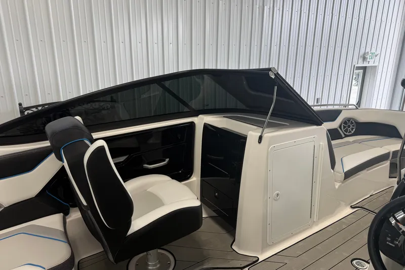 Slide: The Image of 2022 Yamaha Boats 212XD interior with sleek seating and modern dashboard design. - 7