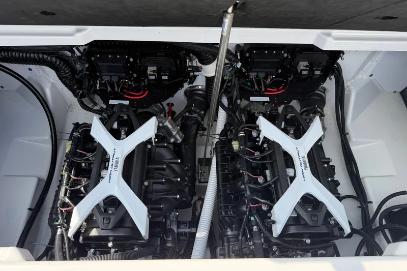 Slide: The Image of Twin engines of a 2022 Yamaha Boats 212XD, showcasing high-performance components. - 3