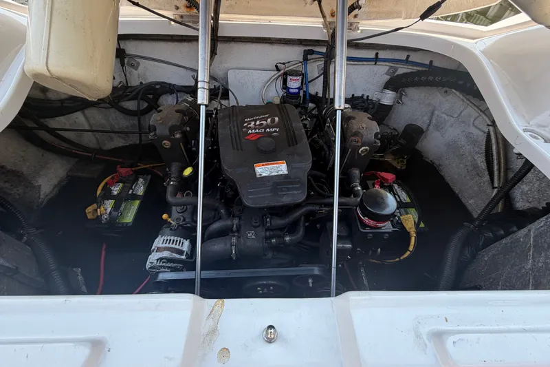Slide: The Image of Engine compartment of a 2008 Crownline 240 LS boat, featuring a MerCruiser 350 MAG MPI engine. - 30