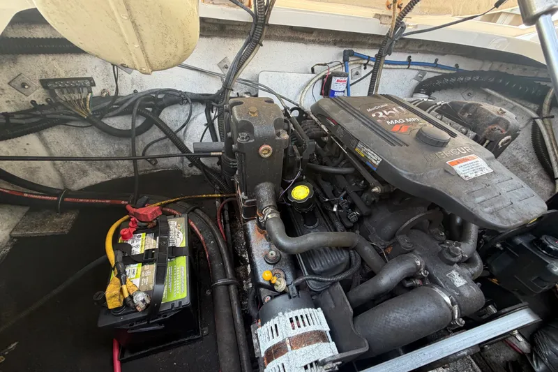 Slide: The Image of Engine compartment of a 2008 Crownline 240 LS boat with MerCruiser engine and battery. - 32