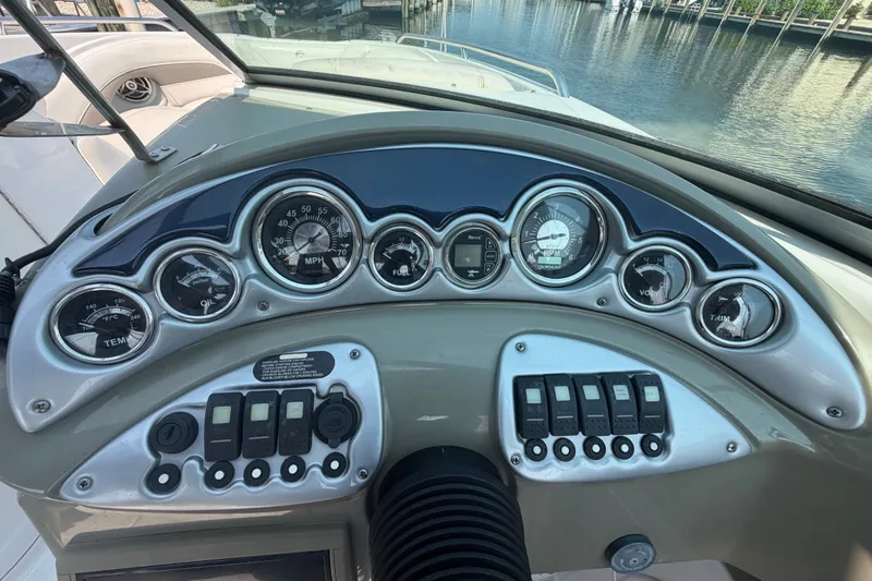 Slide: The Image of Dashboard of a 2008 Crownline 240 LS boat with gauges and controls. - 19