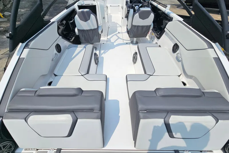 Slide: The Image of 2023 Yamaha Boats AR250 interior with sleek seating and modern design. - 8