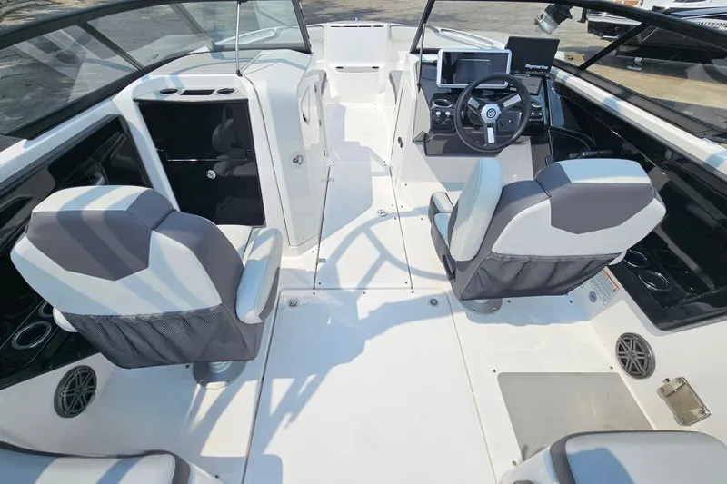 Slide: The Image of 2023 Yamaha Boats AR250 interior with modern seating and sleek dashboard design. - 9