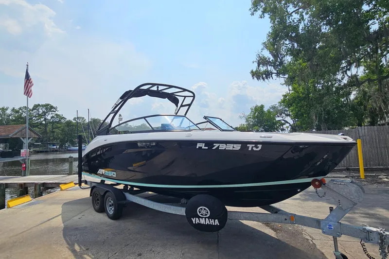 Slide: The Image of 2023 Yamaha Boats AR250 on trailer at dockside, ready for launch. - 2