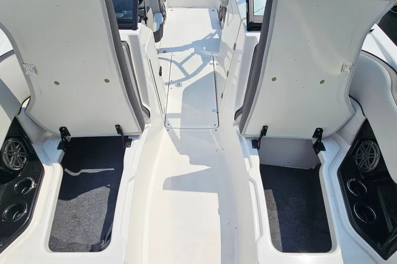 Slide: The Image of 2023 Yamaha Boats AR250 interior seating and storage compartments. - 14