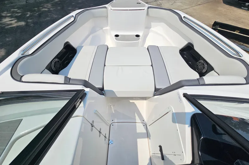 Slide: The Image of 2023 Yamaha Boats AR250 interior with spacious seating and modern design. - 15