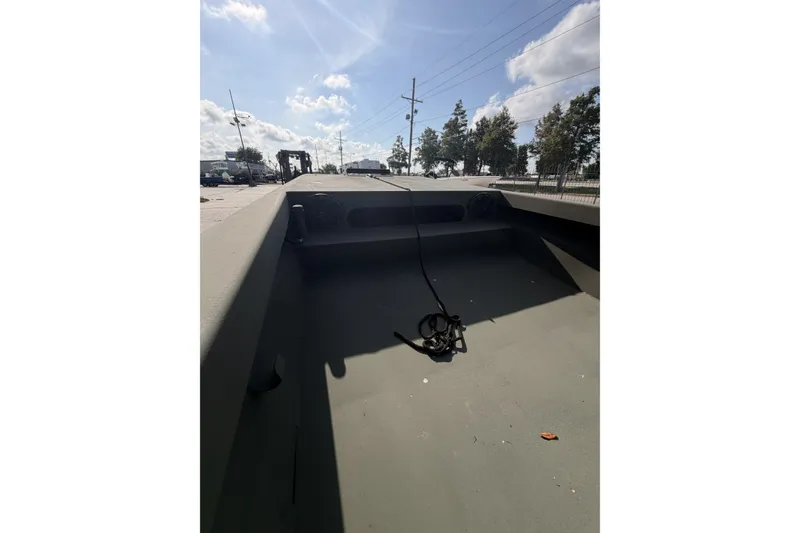 Slide: The Image of 2019 Patriot 2054 boat interior with rope, under a sunny sky. - 6