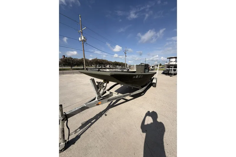 Slide: The Image of 2019 Patriot 2054 boat on trailer under clear blue sky. - 8