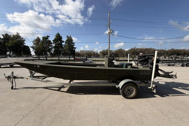 Slide: The Image of 2019 Patriot 2054 boat on trailer under clear blue sky. - 7