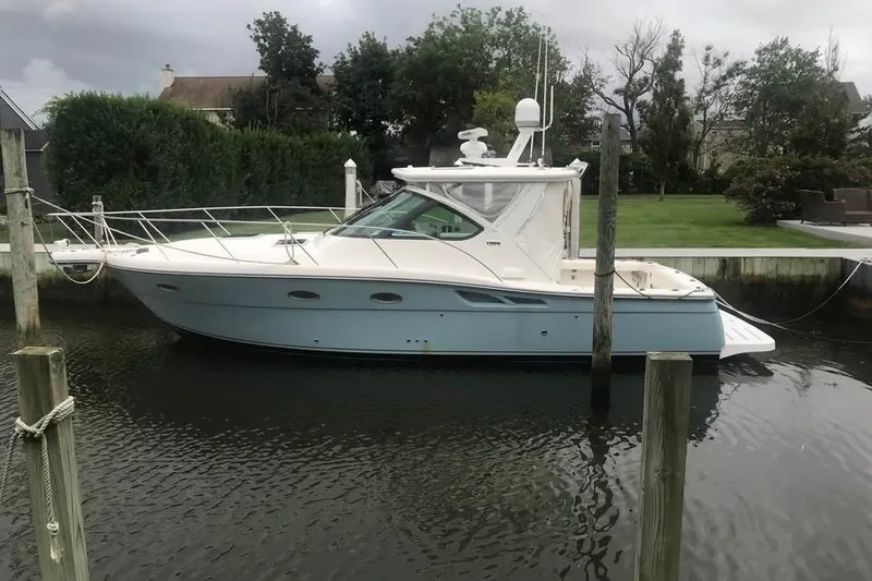 The Image of 2006 Tiara 32 OPEN yacht docked in a serene marina setting. - 0