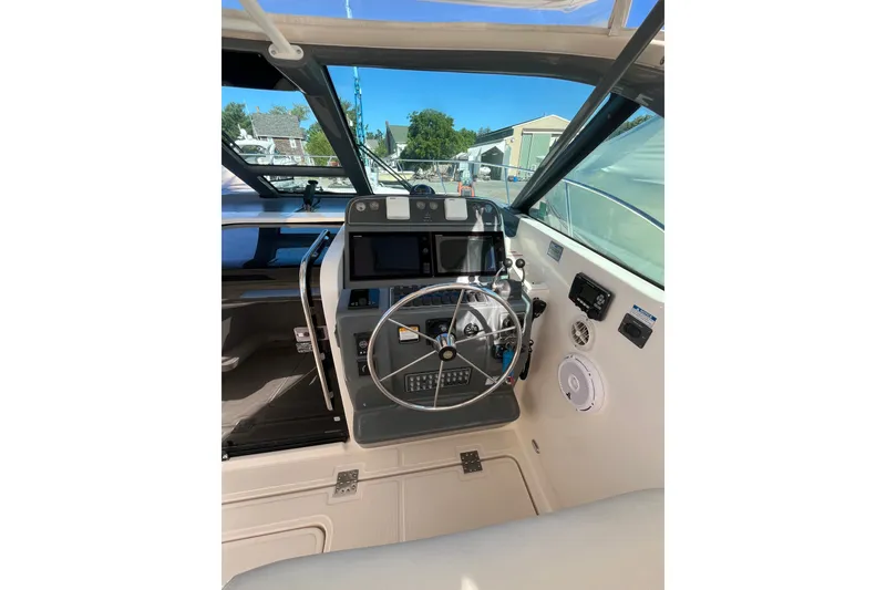 Slide: The Image of Helm of 2006 Tiara 32 OPEN boat with steering wheel and control panel. - 9