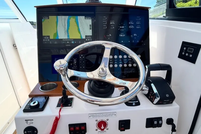 Slide: The Image of 2024 Southport 33 DC helm with advanced navigation and control systems. - 18