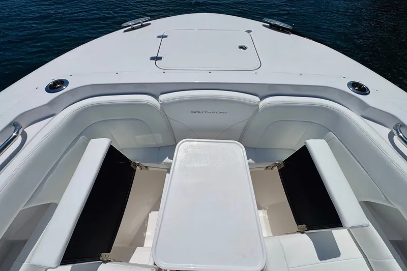 Slide: The Image of Luxurious seating area on 2024 Southport 33 DC boat, featuring sleek white upholstery. - 30