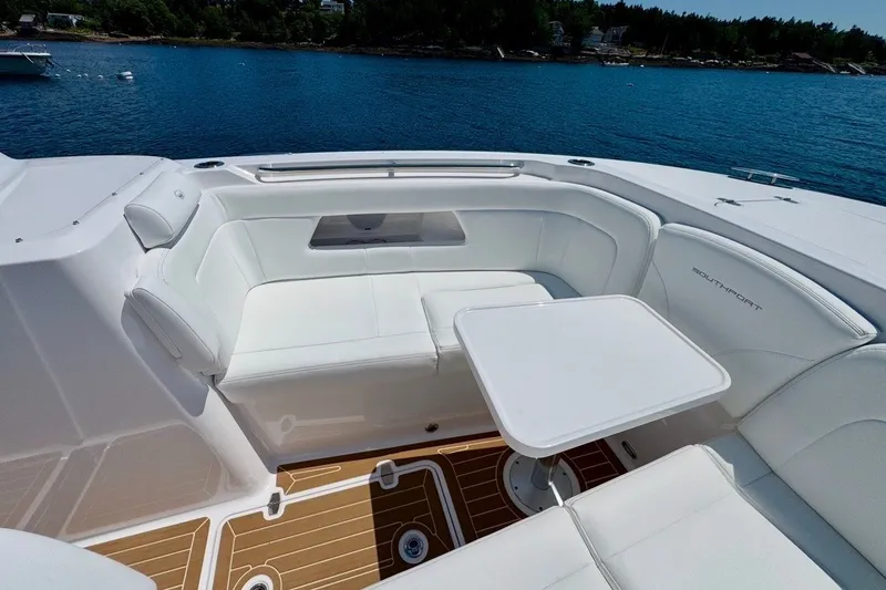 Slide: The Image of Luxurious seating area on 2024 Southport 33 DC boat with scenic water view. - 28