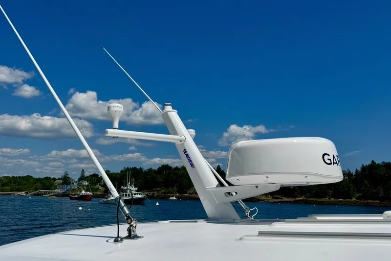 Slide: The Image of 2024 Southport 33 DC boat with radar equipment against a clear blue sky. - 31