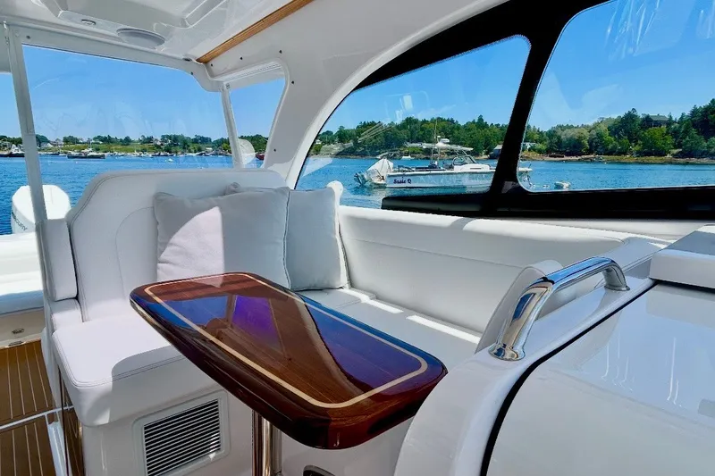 Slide: The Image of Luxurious interior of 2024 Southport 33 DC boat with scenic waterfront view. - 16