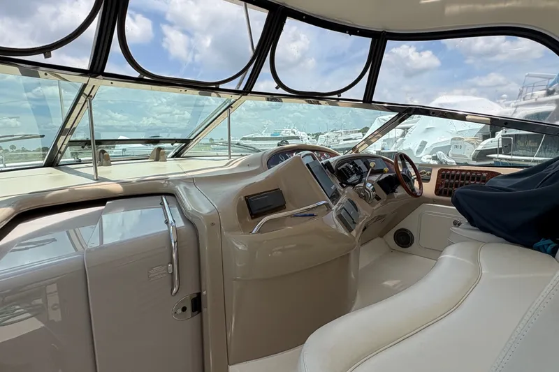 Slide: The Image of Helm of 2001 Sea Ray Sundancer 460 yacht with modern controls and panoramic view. - 18