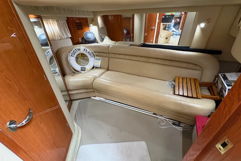 Slide: The Image of Interior of 2001 Sea Ray Sundancer 460 yacht with beige leather seating. - 11