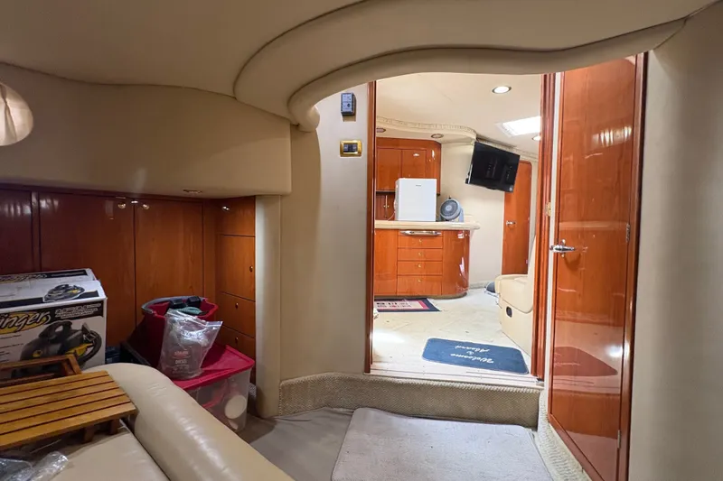 Slide: The Image of Interior of 2001 Sea Ray Sundancer 460 yacht with wood cabinetry and modern amenities. - 12