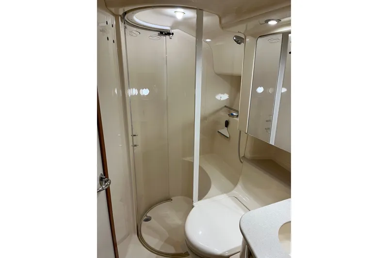 Slide: The Image of Bathroom interior of 2001 Sea Ray Sundancer 460 yacht, featuring shower and toilet. - 42
