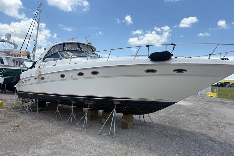 Slide: The Image of 2001 Sea Ray Sundancer 460 yacht on stands, clear sky background. - 3