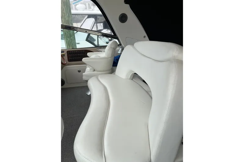 Slide: The Image of Interior seating of 2001 Sea Ray Sundancer 460 yacht, featuring white leather upholstery. - 34