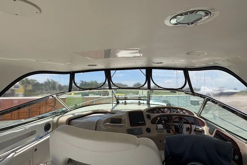 Slide: The Image of Interior view of 2001 Sea Ray Sundancer 460 yacht cockpit with steering wheel and dashboard. - 28