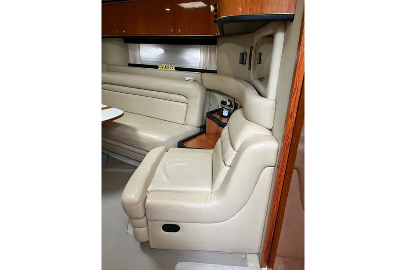 Slide: The Image of Luxurious interior of 2001 Sea Ray Sundancer 460 yacht with beige leather seating. - 32
