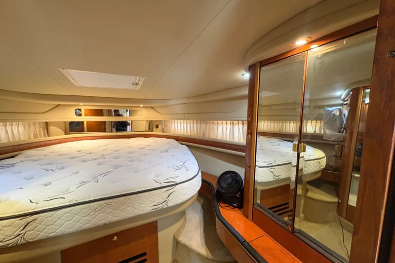Slide: The Image of Luxurious cabin interior of 2001 Sea Ray Sundancer 460 yacht with mirrored closet. - 21