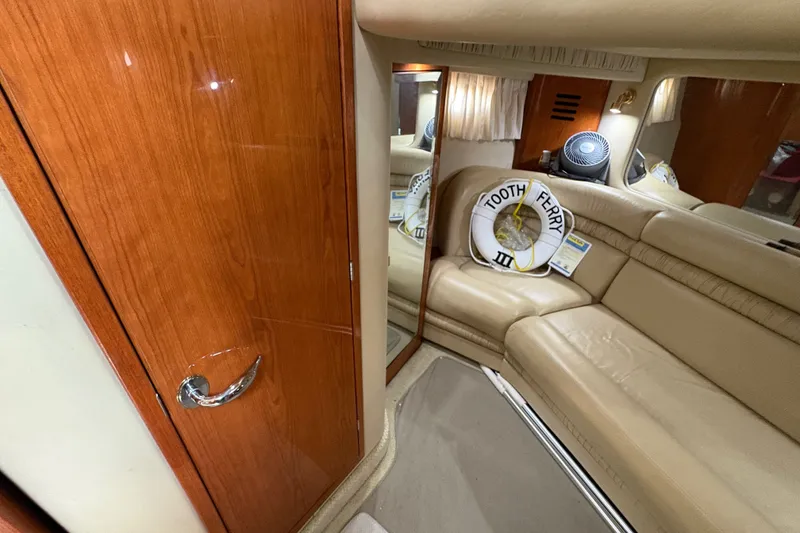 Slide: The Image of Luxurious interior of 2001 Sea Ray Sundancer 460 yacht with beige seating and wooden accents. - 6