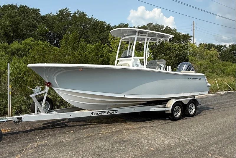 Slide: The Image of 2023 Sportsman Heritage 231 Center Console boat on trailer, parked outdoors. - 5