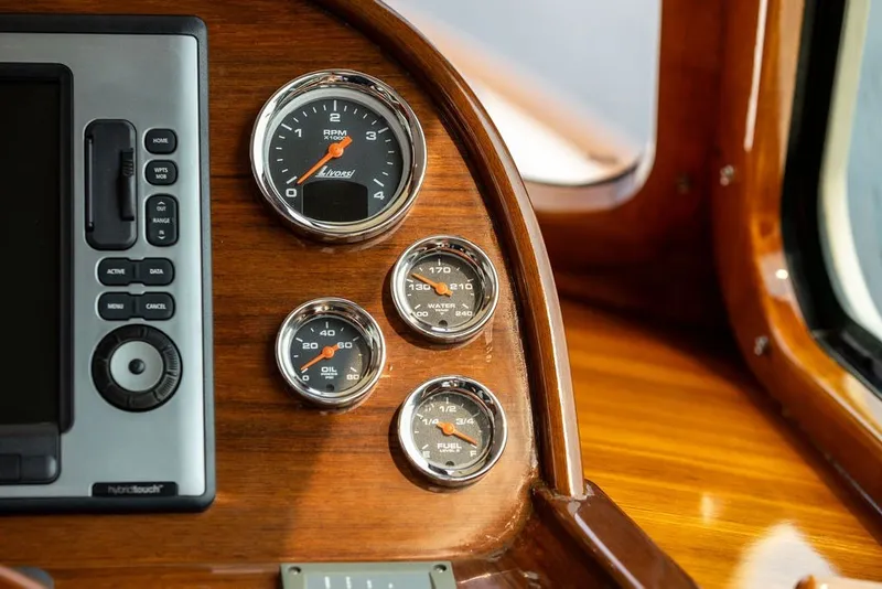 Slide: The Image of Hinckley Picnic Boat MKIII 2012 dashboard with gauges and navigation controls. - 10