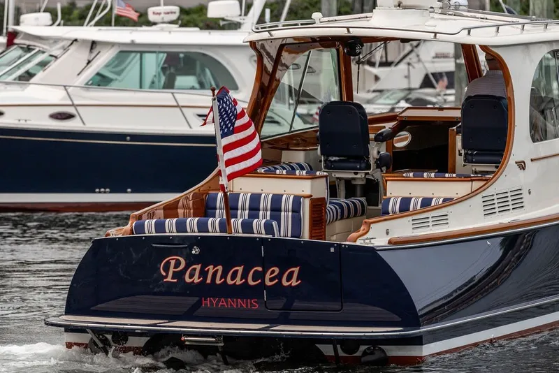 Slide: The Image of Hinckley Picnic Boat MKIII 2012, named "Panacea," docked in Hyannis harbor. - 4