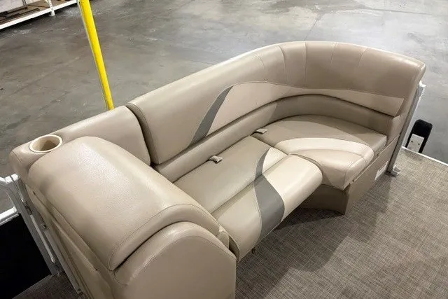 Slide: The Image of Beige leather seating on 2015 SunCatcher V22 RC boat, featuring cup holder and modern design. - 3