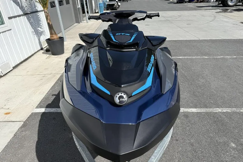Slide: The Image of 2024 Sea-Doo GTX 230 jet ski parked outdoors, showcasing sleek design and branding. - 8