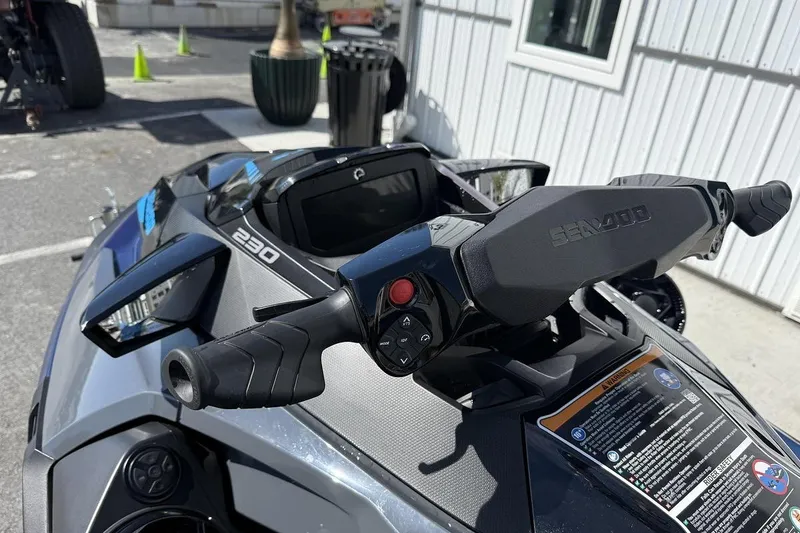 Slide: The Image of 2024 Sea-Doo GTX 230 handlebars and dashboard, showcasing sleek design and controls. - 5