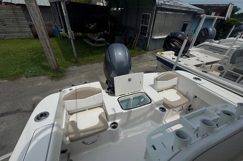 Slide: The Image of 2023 Robalo R200 Center Console boat interior with seating and storage compartments. - 16