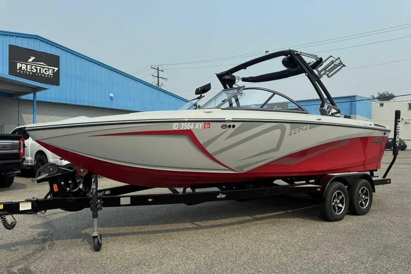 Slide: The Image of 2018 Tigé R21 boat on trailer at Prestige Water Sports dealership. - 13