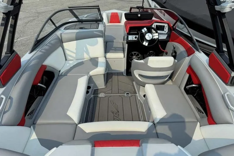 Slide: The Image of 2018 Tigé R21 boat interior with modern seating and sleek dashboard design. - 3