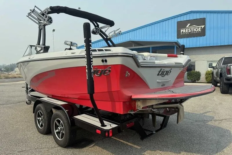 Slide: The Image of 2018 Tigé R21 boat on trailer at Prestige Water Sports dealership. - 2