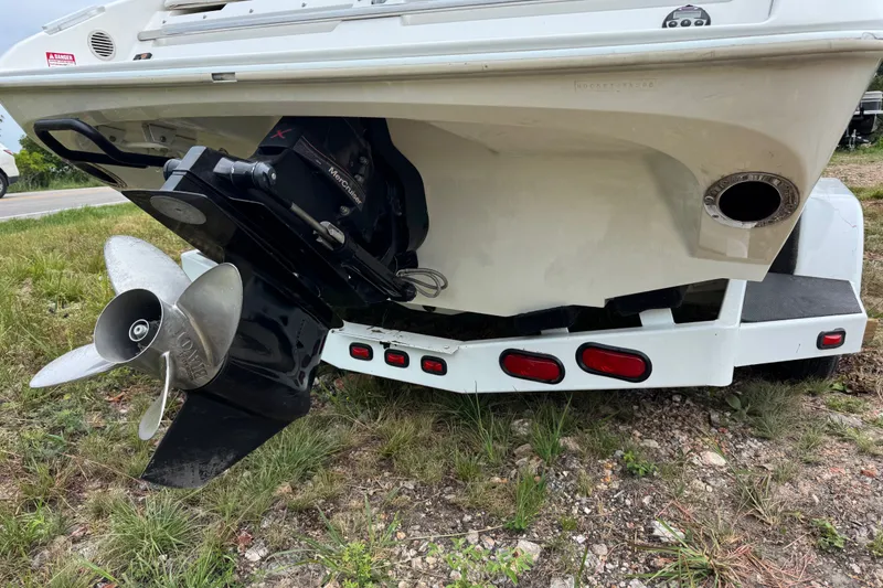 Slide: The Image of Rear view of 2006 Nordic Powerboats 25 Rage with visible propeller and trailer. - 3