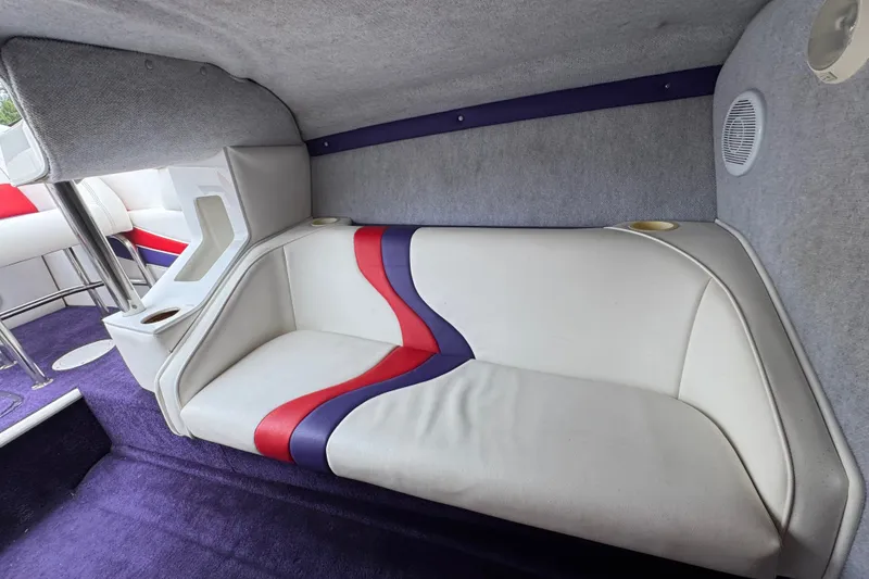 Slide: The Image of Interior of 2006 Nordic Powerboats 25 Rage with white, red, and purple seating. - 19