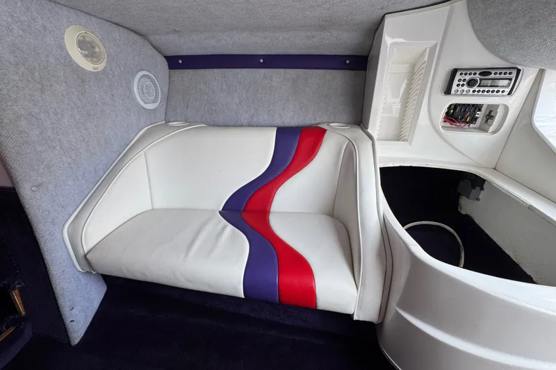 Slide: The Image of Interior of 2006 Nordic Powerboats 25 Rage with white, red, and blue seating. - 18