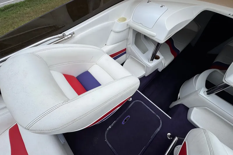 Slide: The Image of Interior of 2006 Nordic Powerboats 25 Rage with white and red seating. - 11