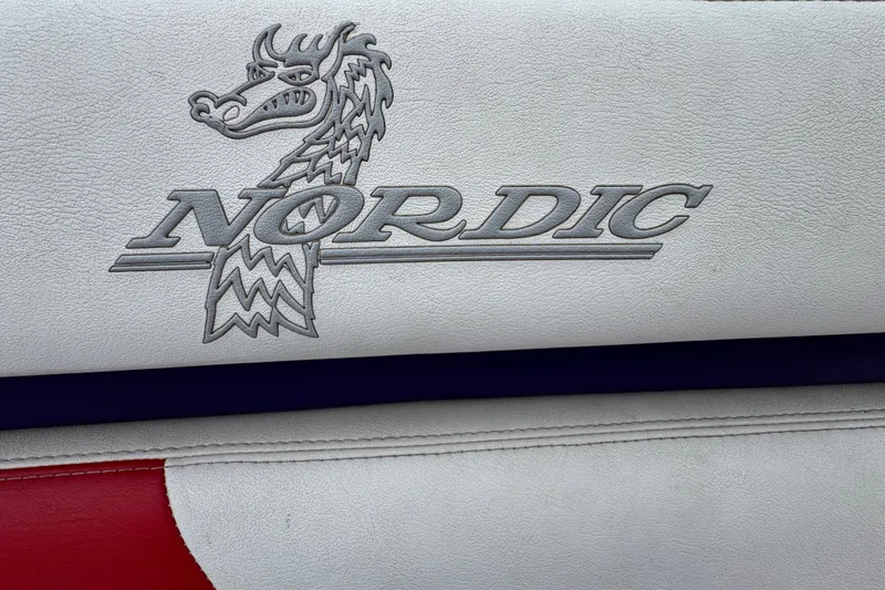 Slide: The Image of Nordic Powerboats 25 Rage 2006 logo on white leather upholstery. - 20
