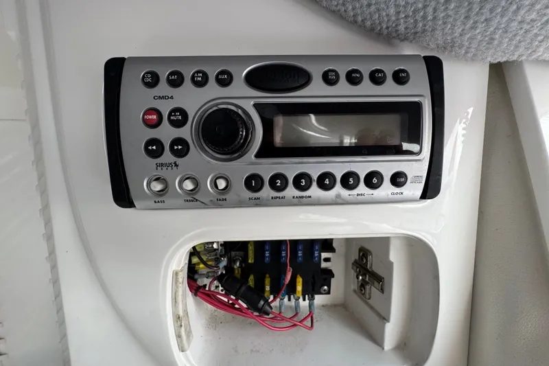 Slide: The Image of Clarion CMD4 stereo system in a 2006 Nordic Powerboats 25 Rage, with wiring compartment. - 21