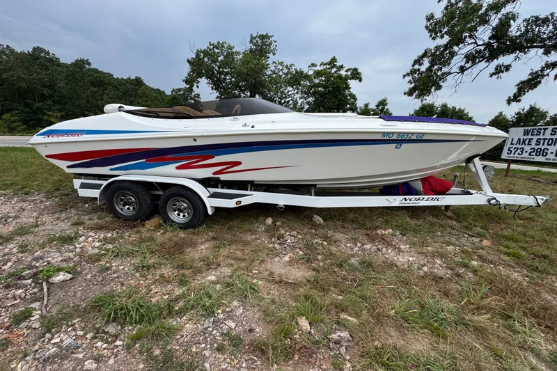 Slide: The Image of 2006 Nordic Powerboats 25 Rage on trailer, featuring sleek design and vibrant graphics. - 1